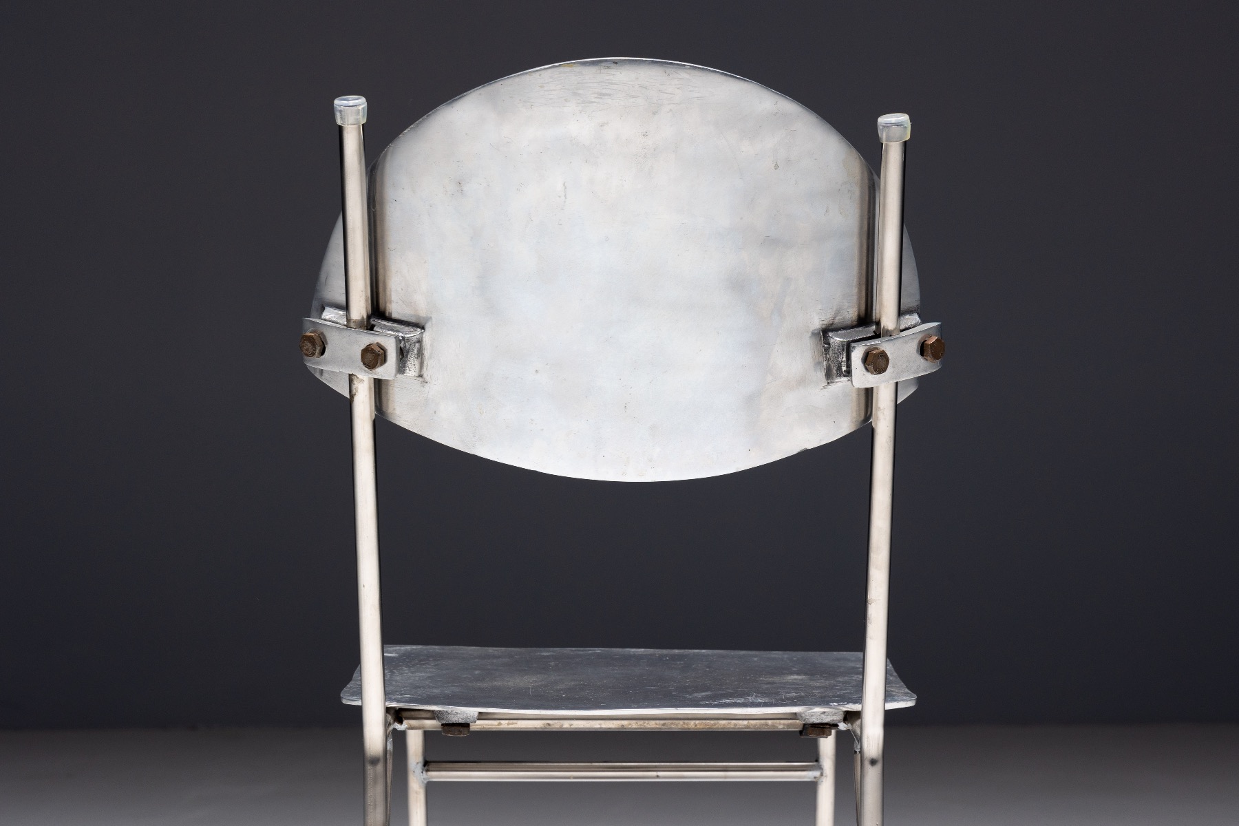 Minimalist aluminum chairs in postmodern style