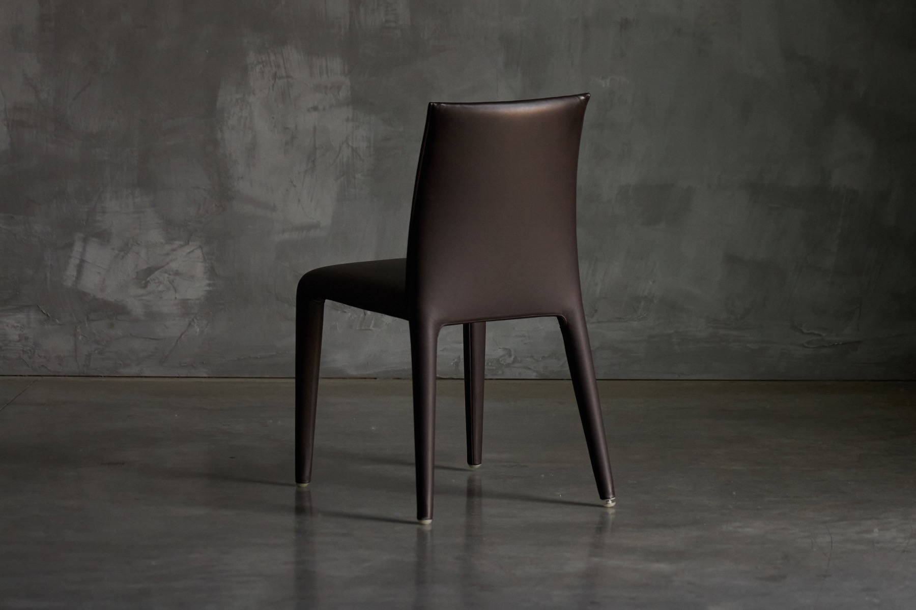 Modern Italian dining chair with soft sculptural silhouette