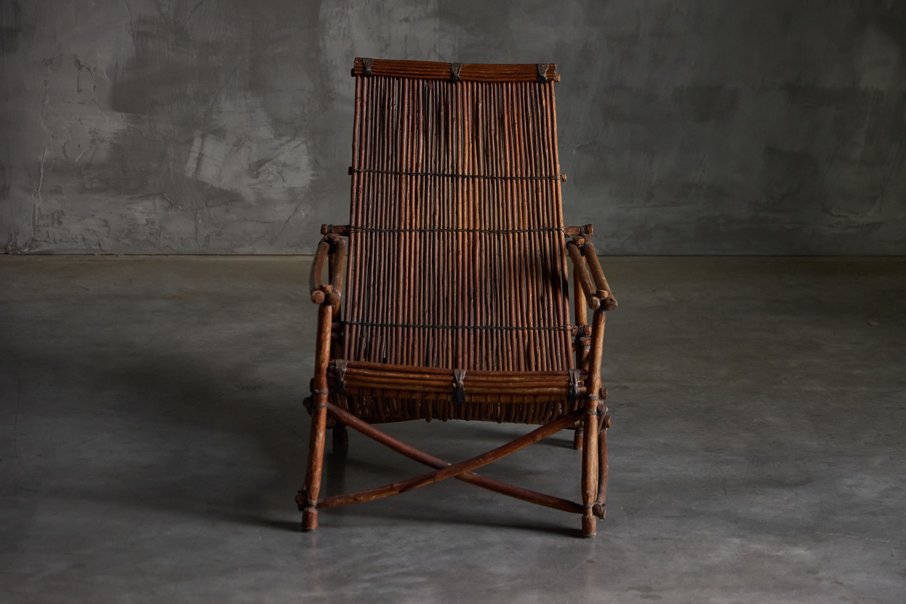 Natural wicker reclining chair with vintage appeal