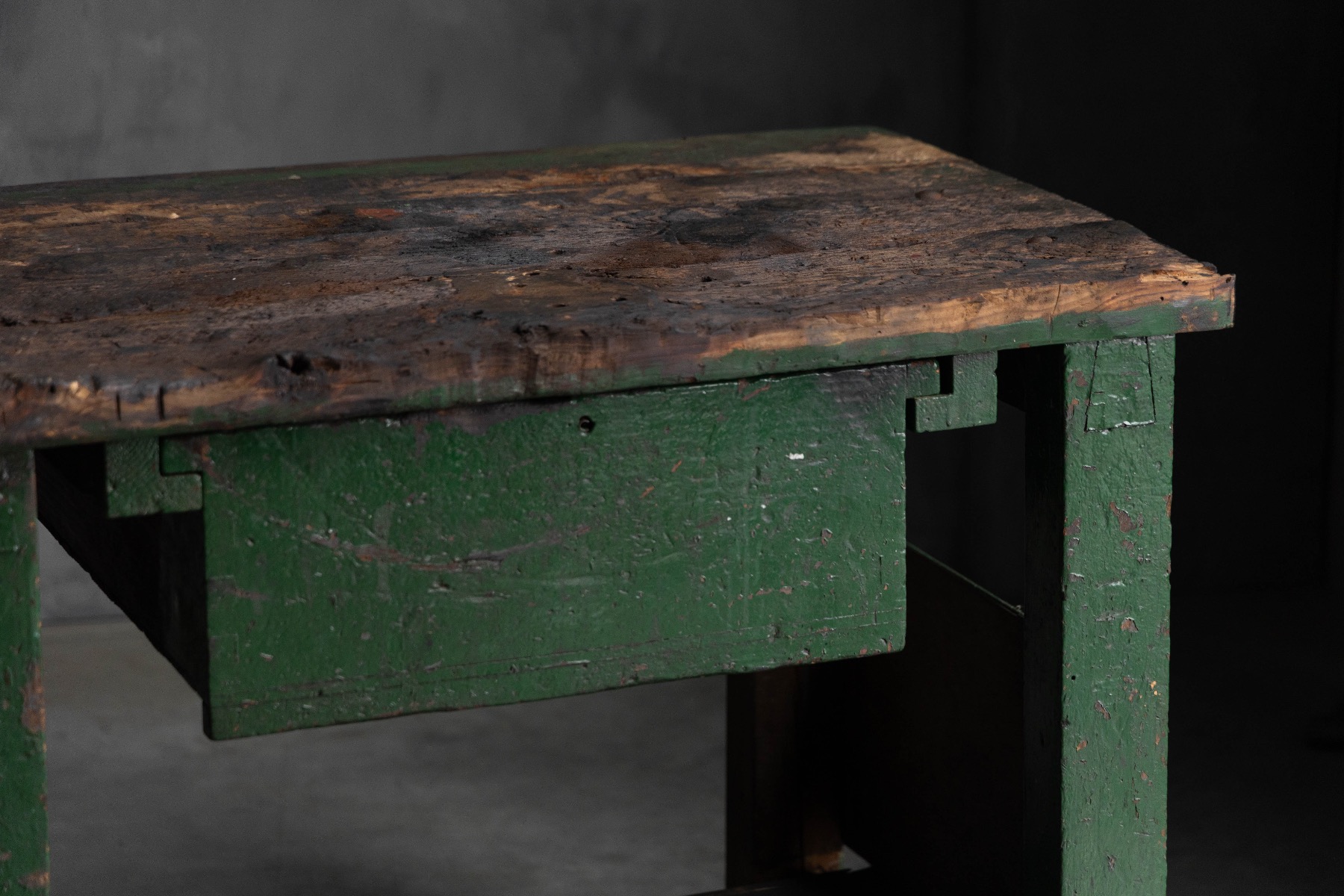 Patinated industrial workbench from a historic workshop