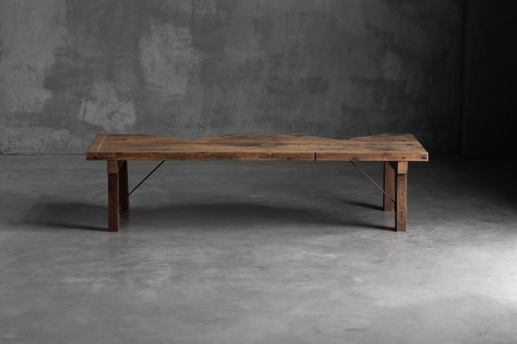 Primitive wooden jeweller table with utilitarian form