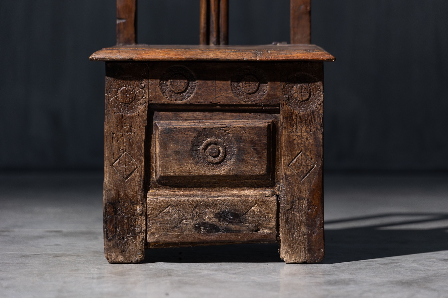 Authentic antique storage seat reflecting folk craftsmanship