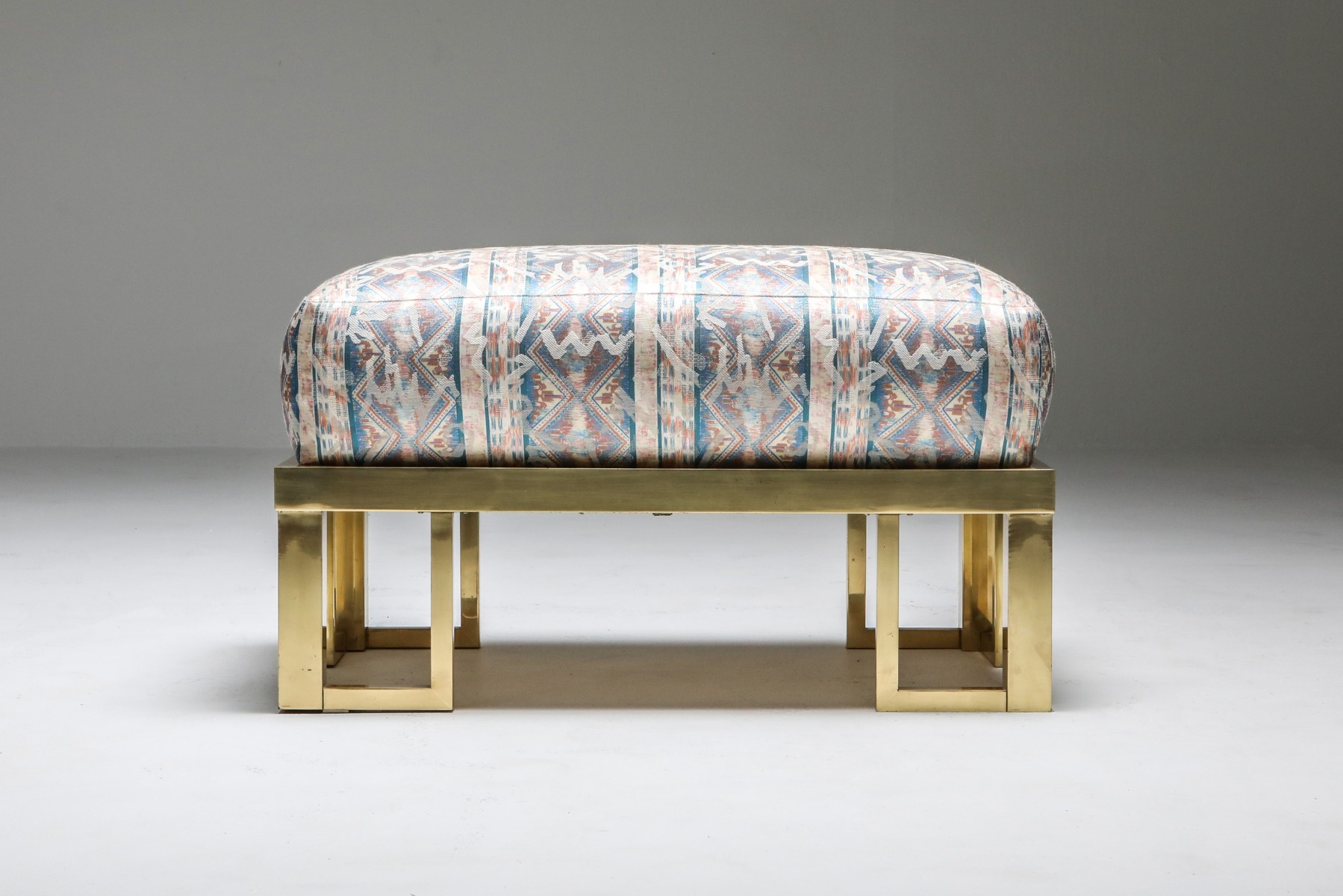 Sculptural brass lounge chair and ottoman design