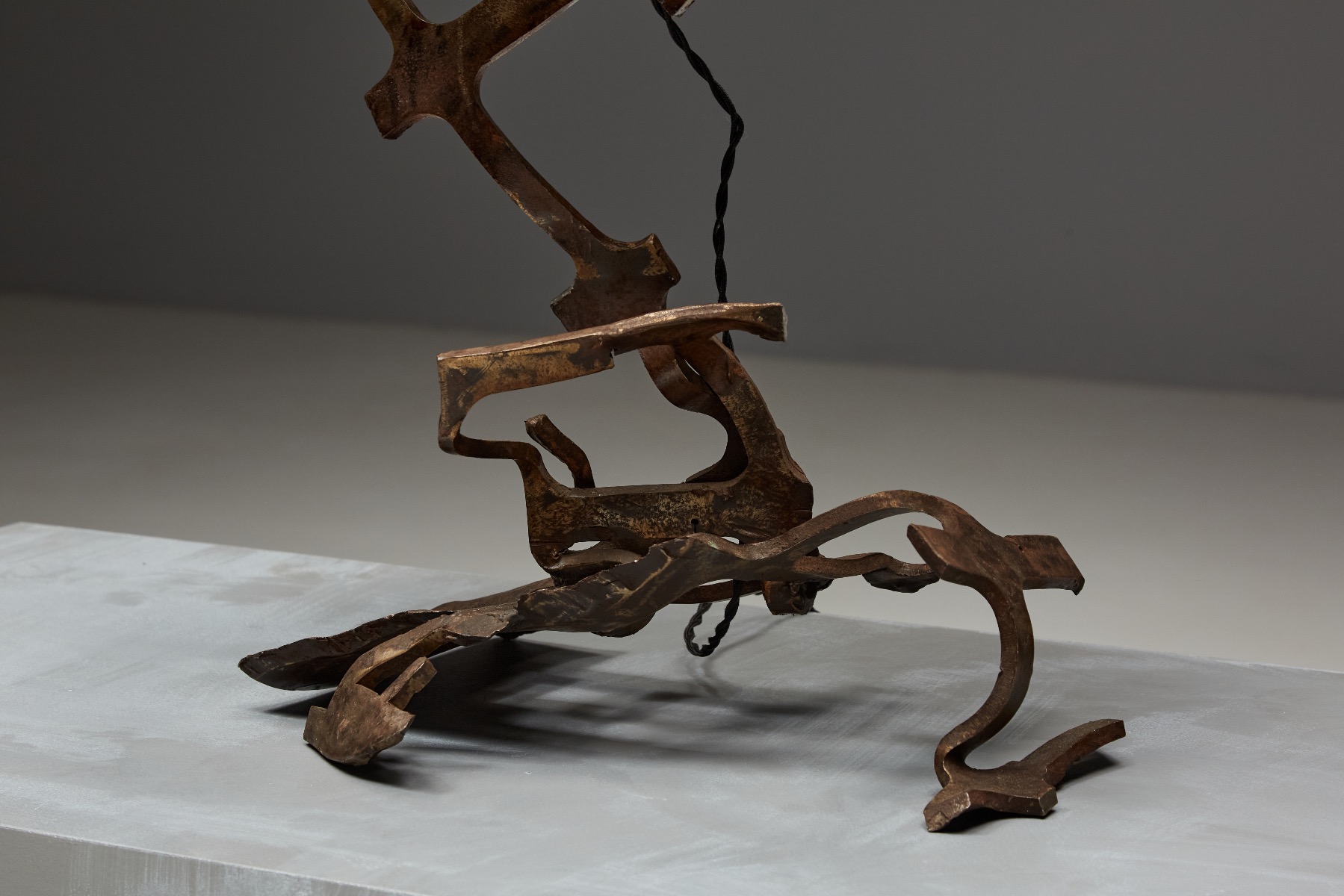 Sculptural iron table lamp in rustic design
