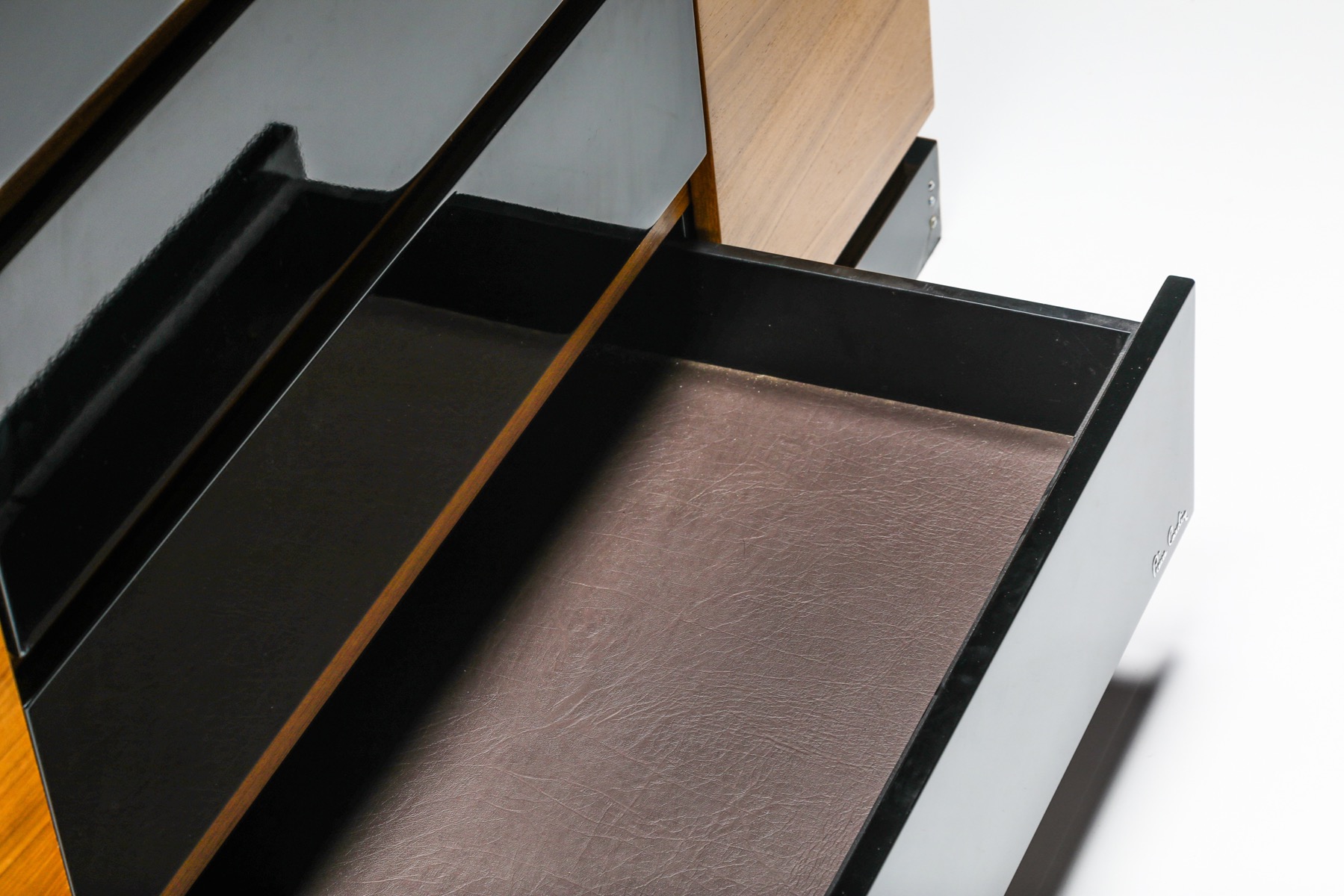 Sleek black lacquer and teak cabinet in postmodern style