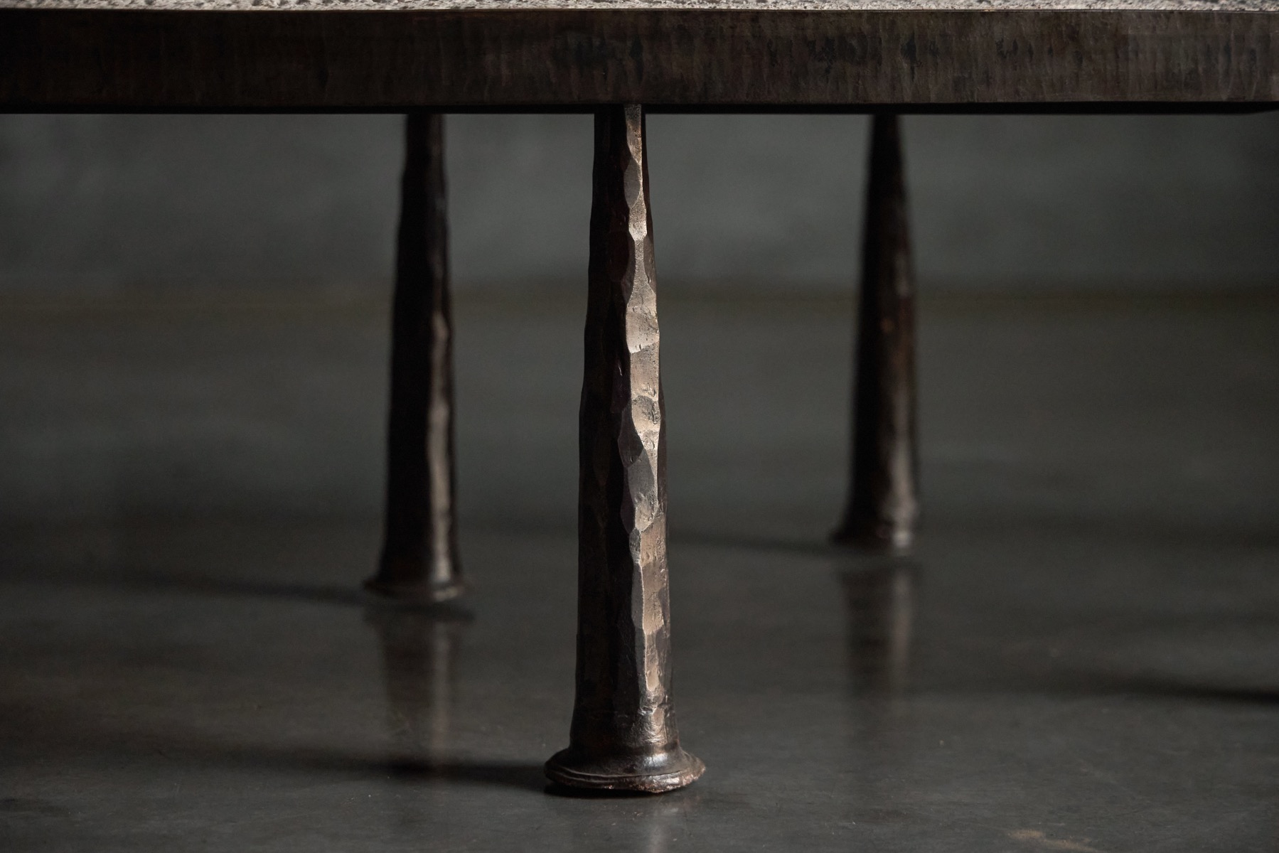 Modern brutalist coffee table in steel and stone by Thomas Serruys