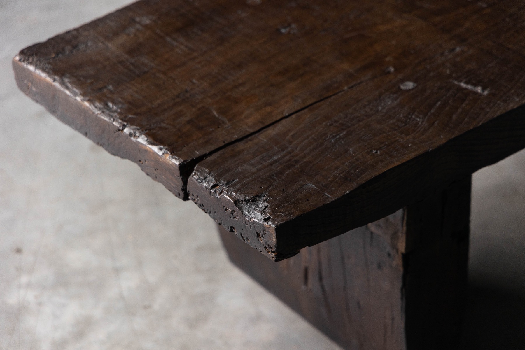 Aged wood brutalist rustic coffee table with deep patina