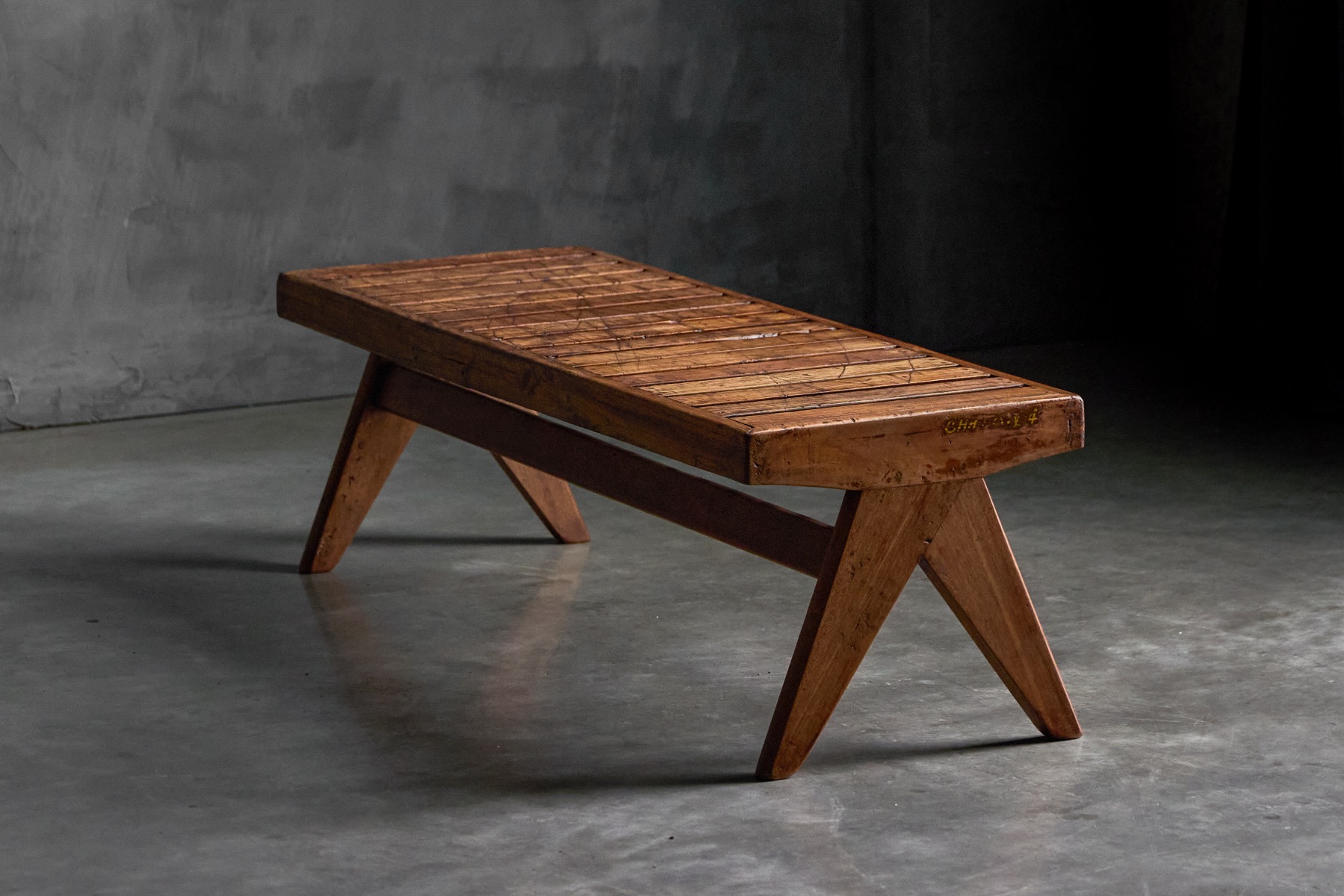 Architectural teak bench with slatted construction
