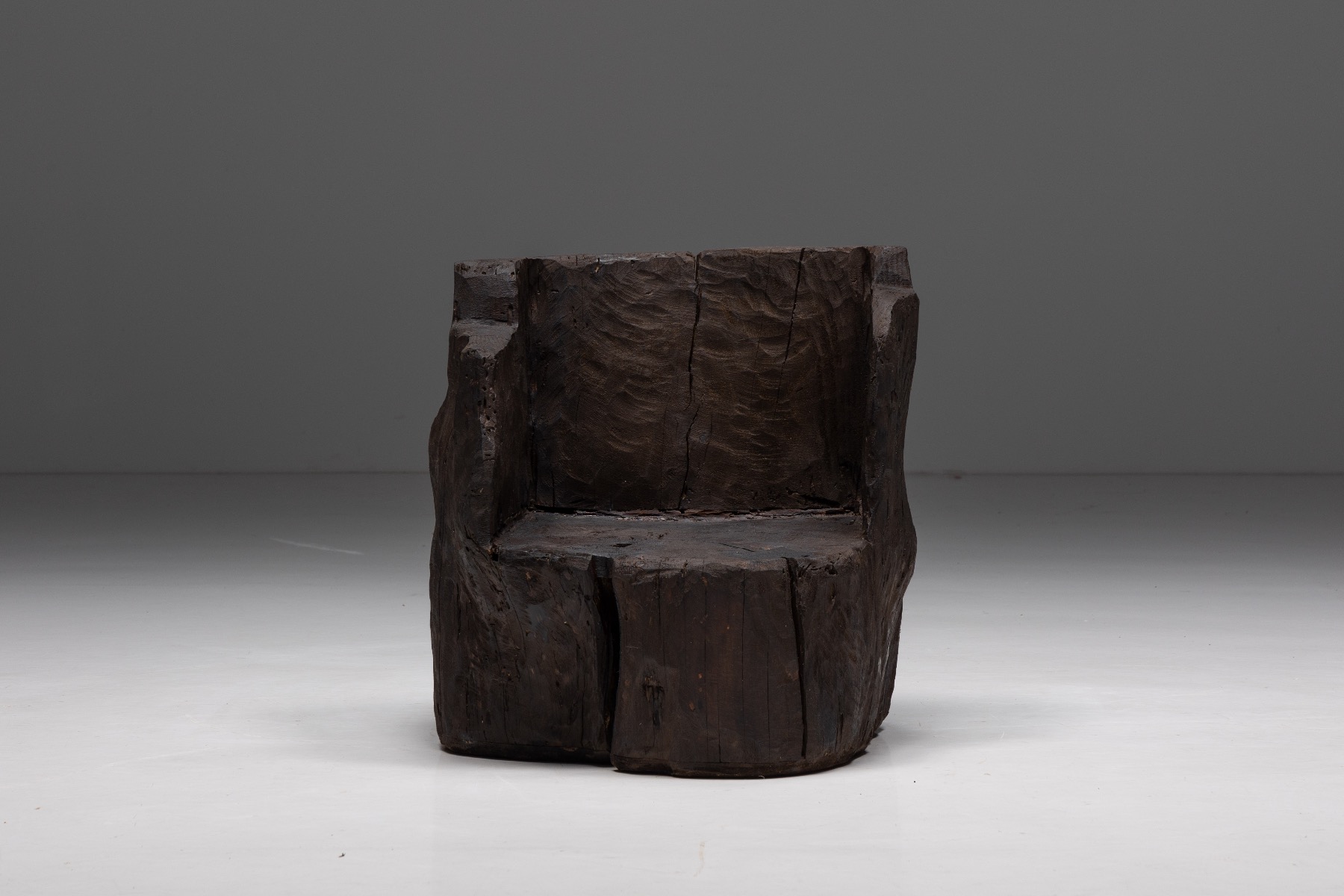 Collectible monoxylite armchairs in brutalist design