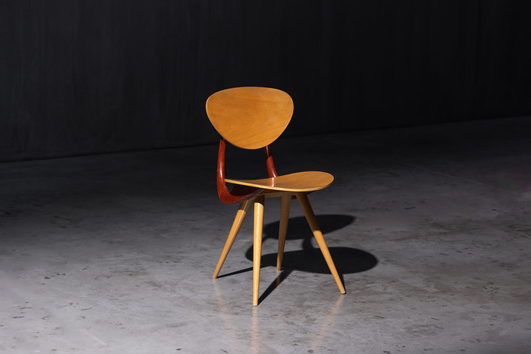 Sculpted wooden chairs with mid century character
