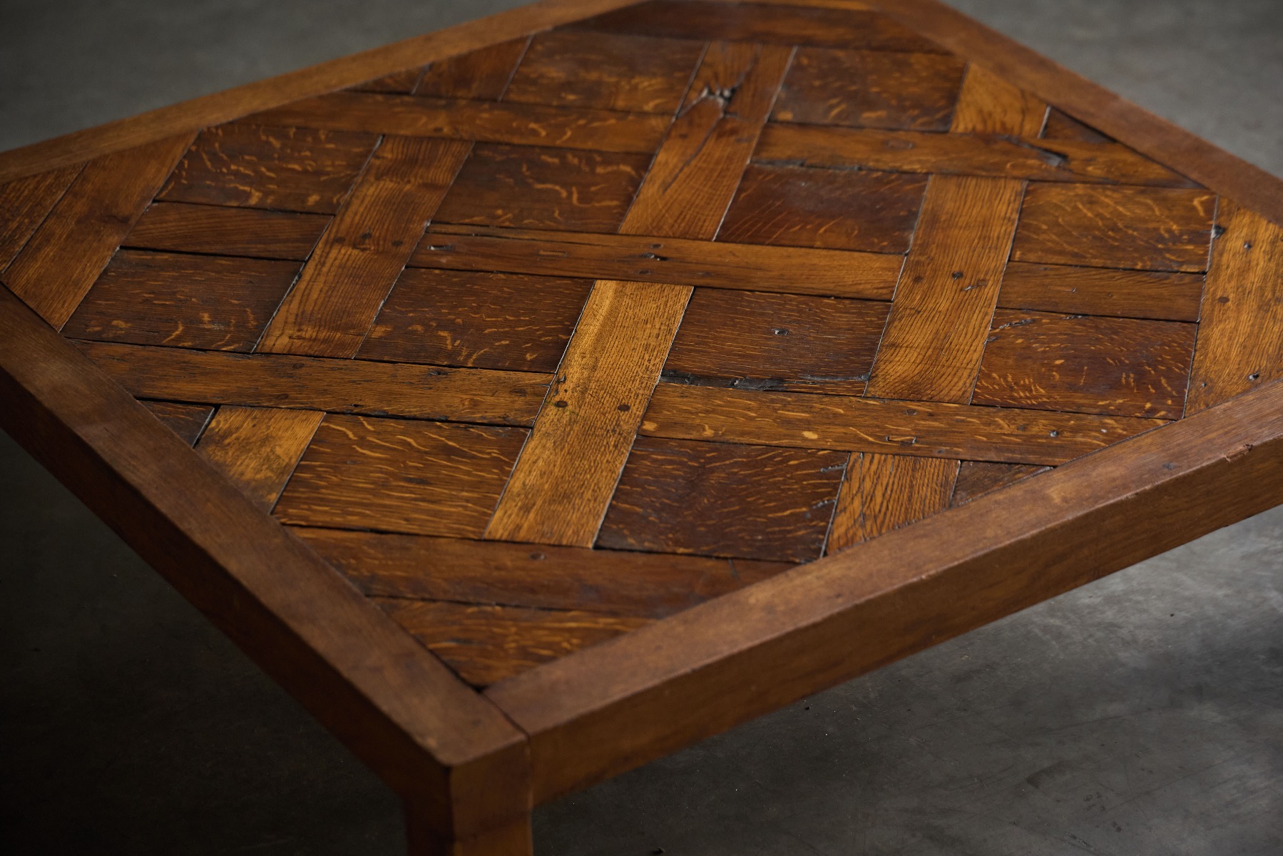 Heavy brutalist parquet coffee table with solid presence