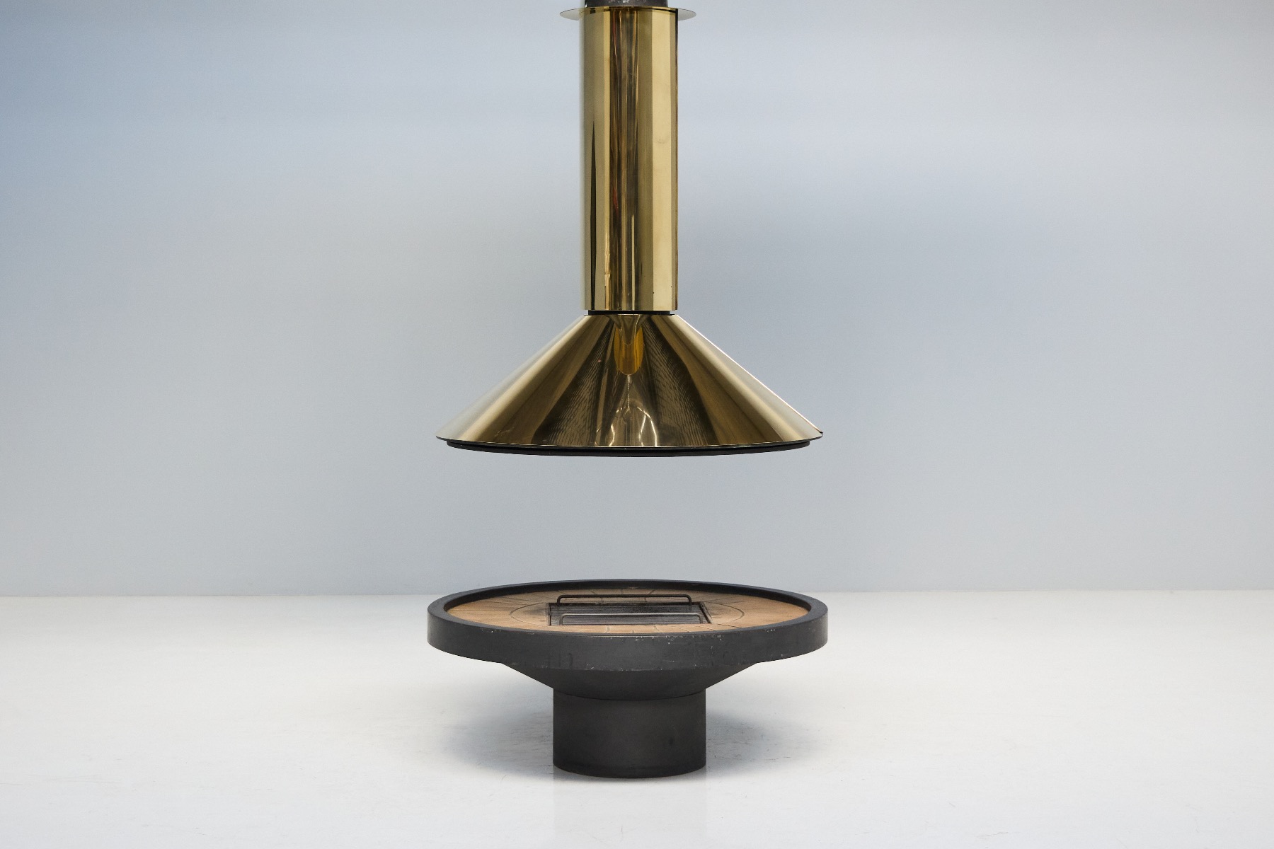 Late mid century freestanding fireplace in solid brass