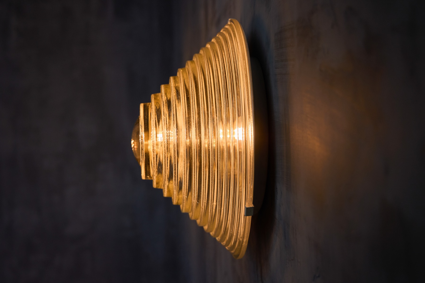 Modernist Italian wall lights featuring ribbed glass