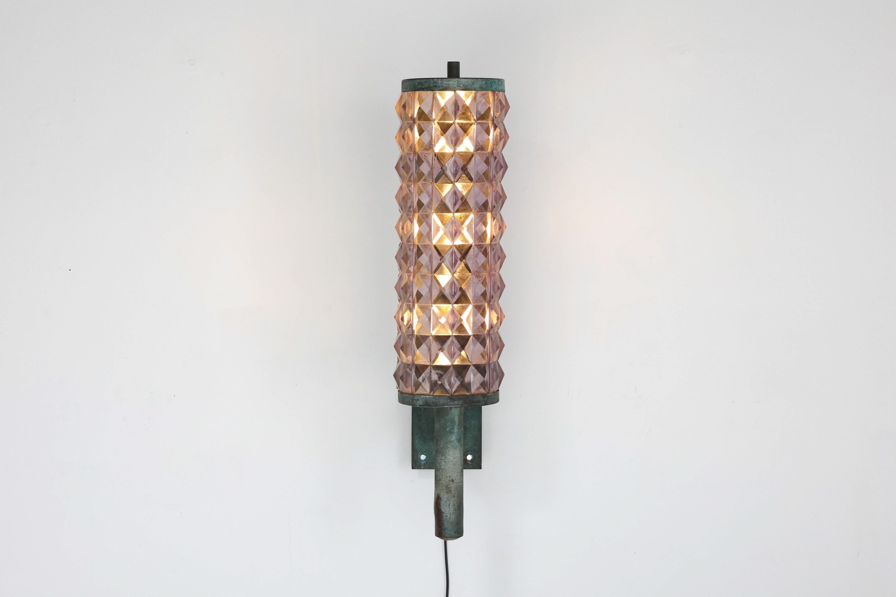Sleek art deco wall sconces in iron and glass design