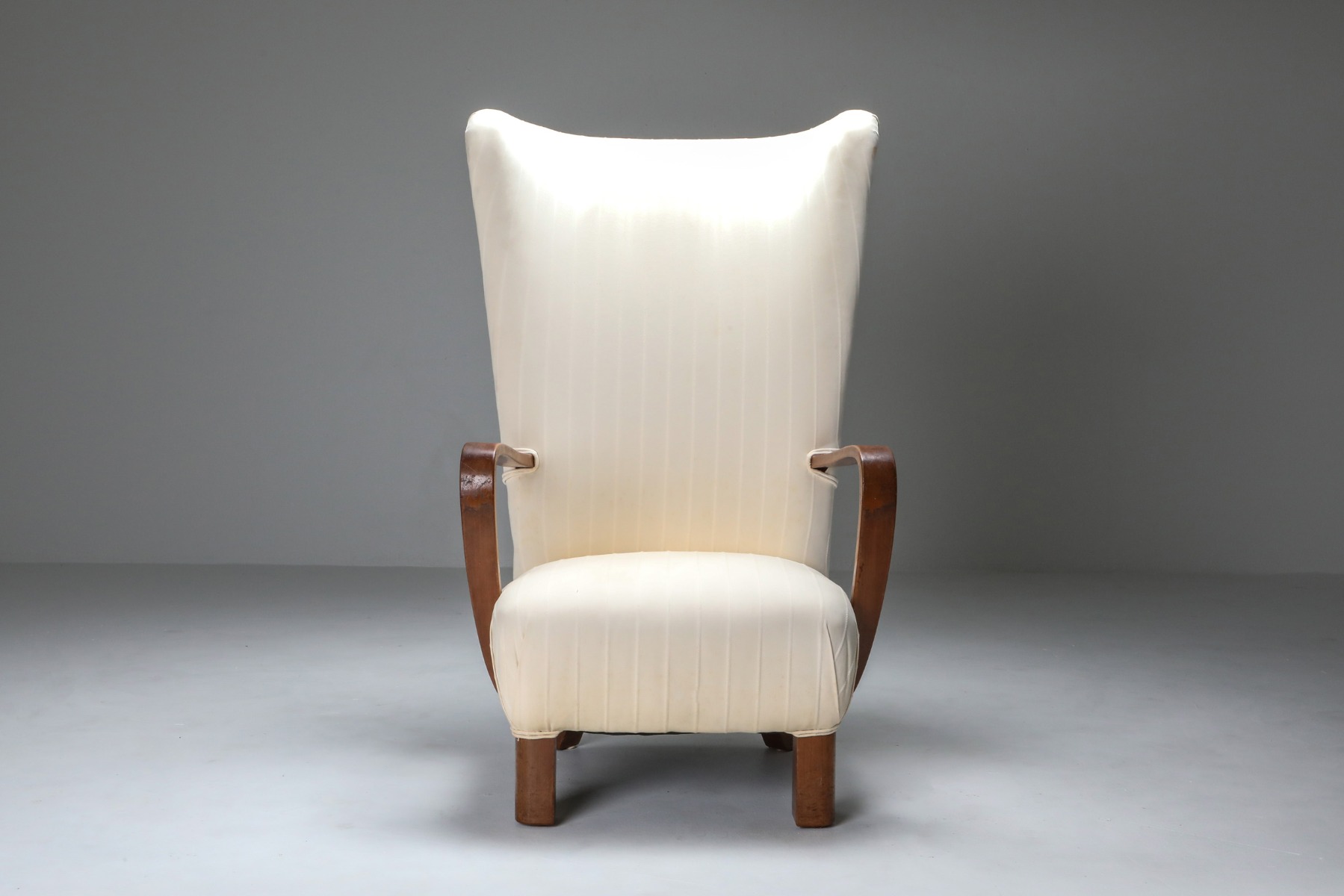 Timeless wingback chair with ottoman from the 1950s