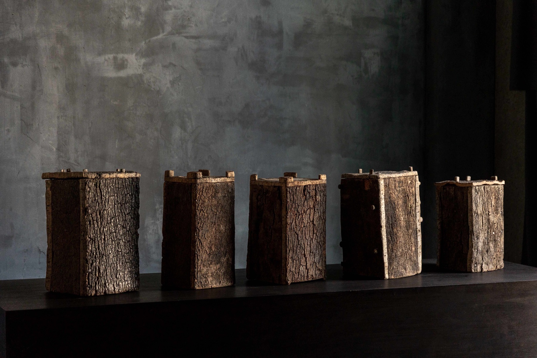 Handcrafted antique beehives made from tree trunks