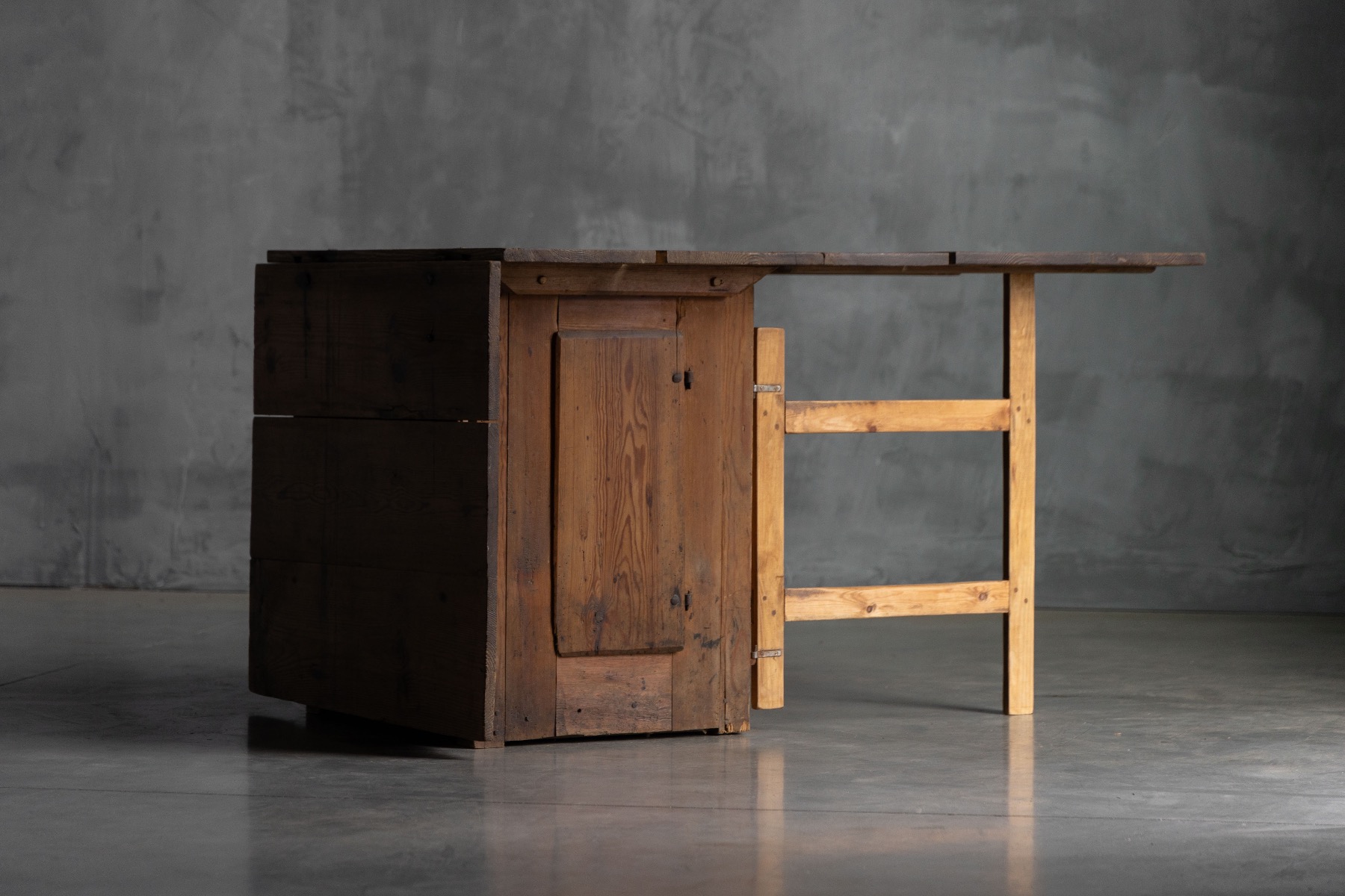 Vernacular wooden worktable with functional drop leaves