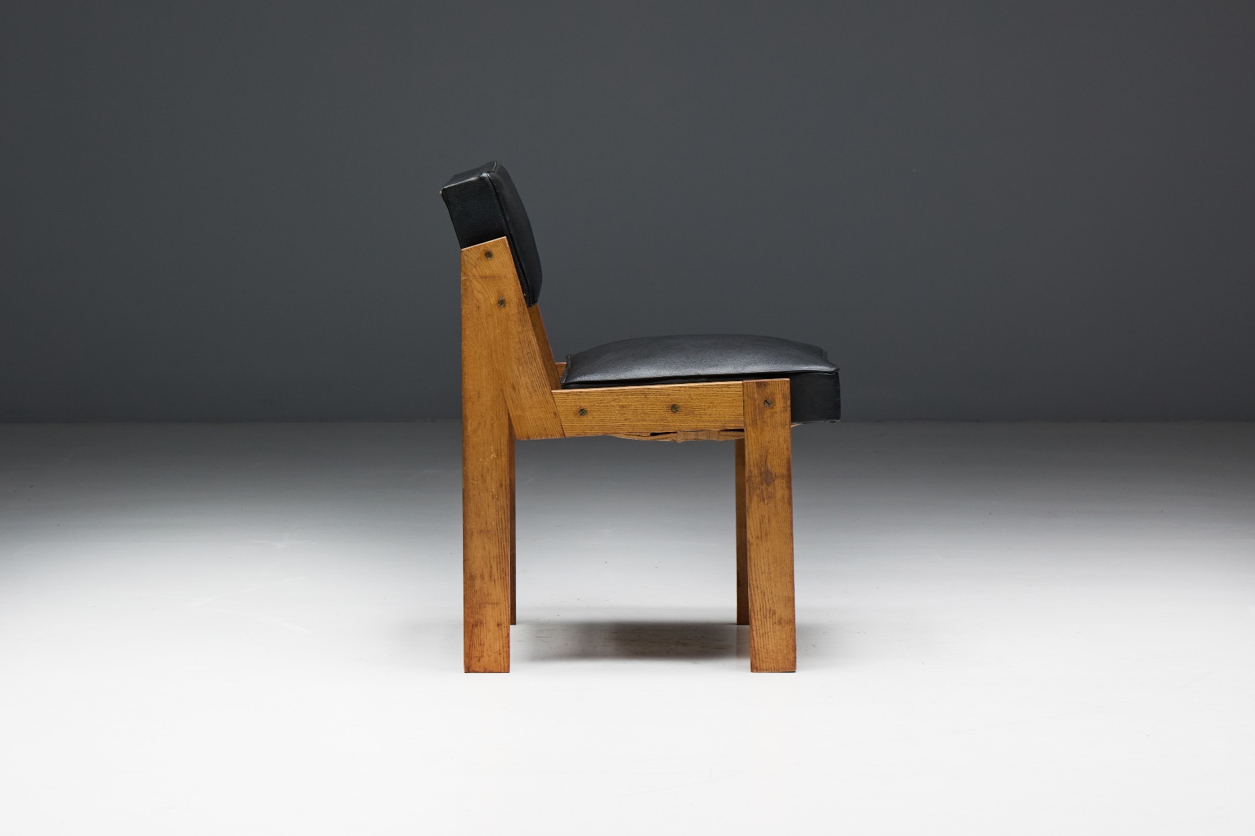 Vintage Dutch chairs in oak and vinyl from the 1950s