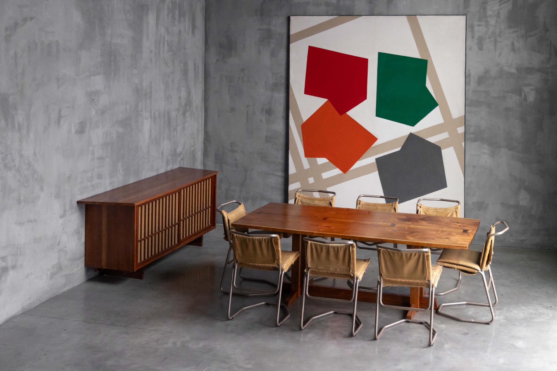 Modernist dining chairs in leather and steel by Raymond Rombouts