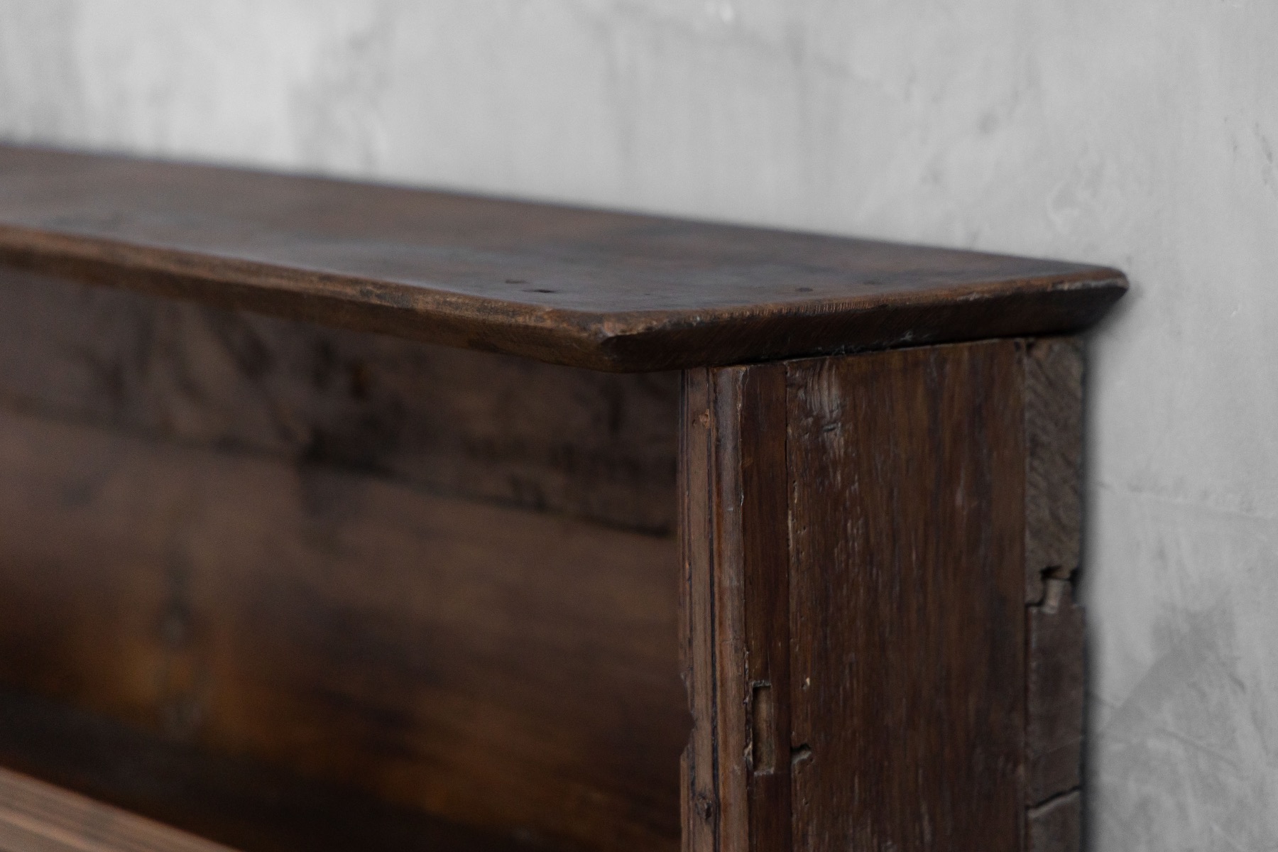 Antique French rustic wall shelf with aged patina and traditional joinery