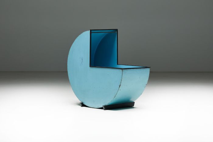 Blue circular wooden cradle from the twentieth century