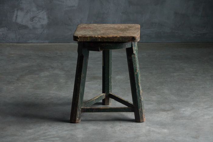 Industrial primitive stool from the 19th century in solid wood