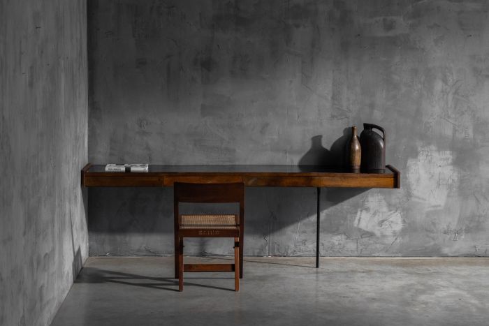 Modernist wall mounted console from France dating to the 1960s with wood and Formica surface