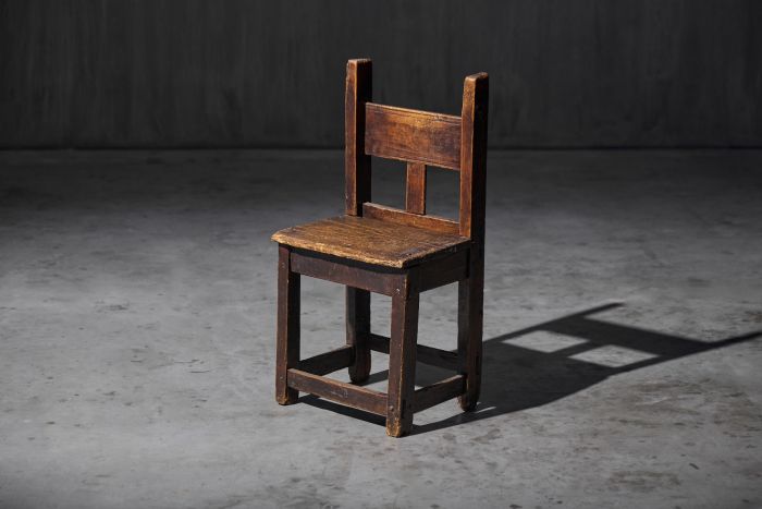 Rustic wooden child’s chair from the early 20th century