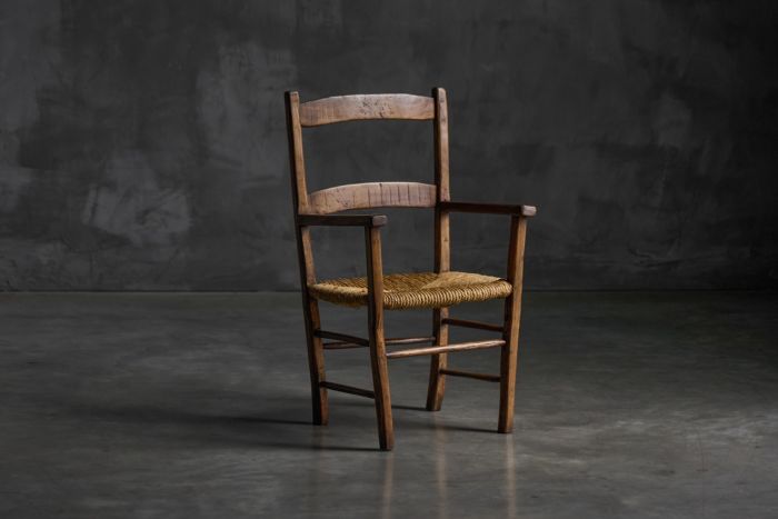 Vernacular rural armchair in solid wood from the early 20th century