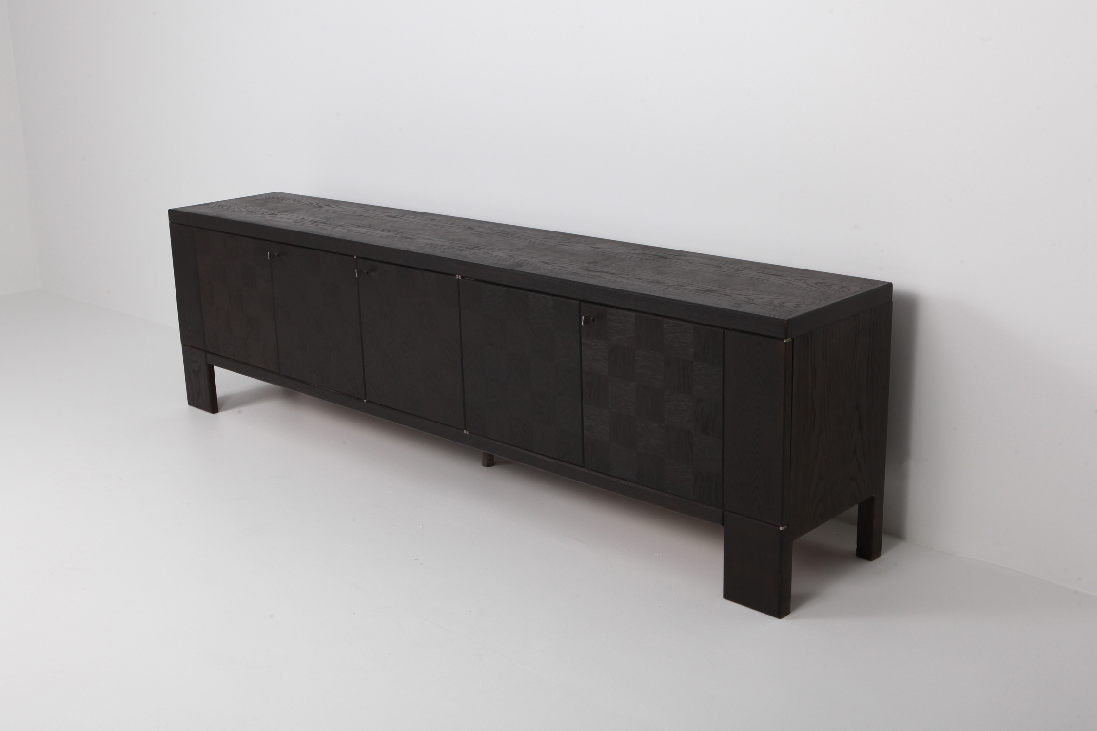 Brutalist Floating Credenza in Stained Oak with Geometric Doors by De Coene - 1970s