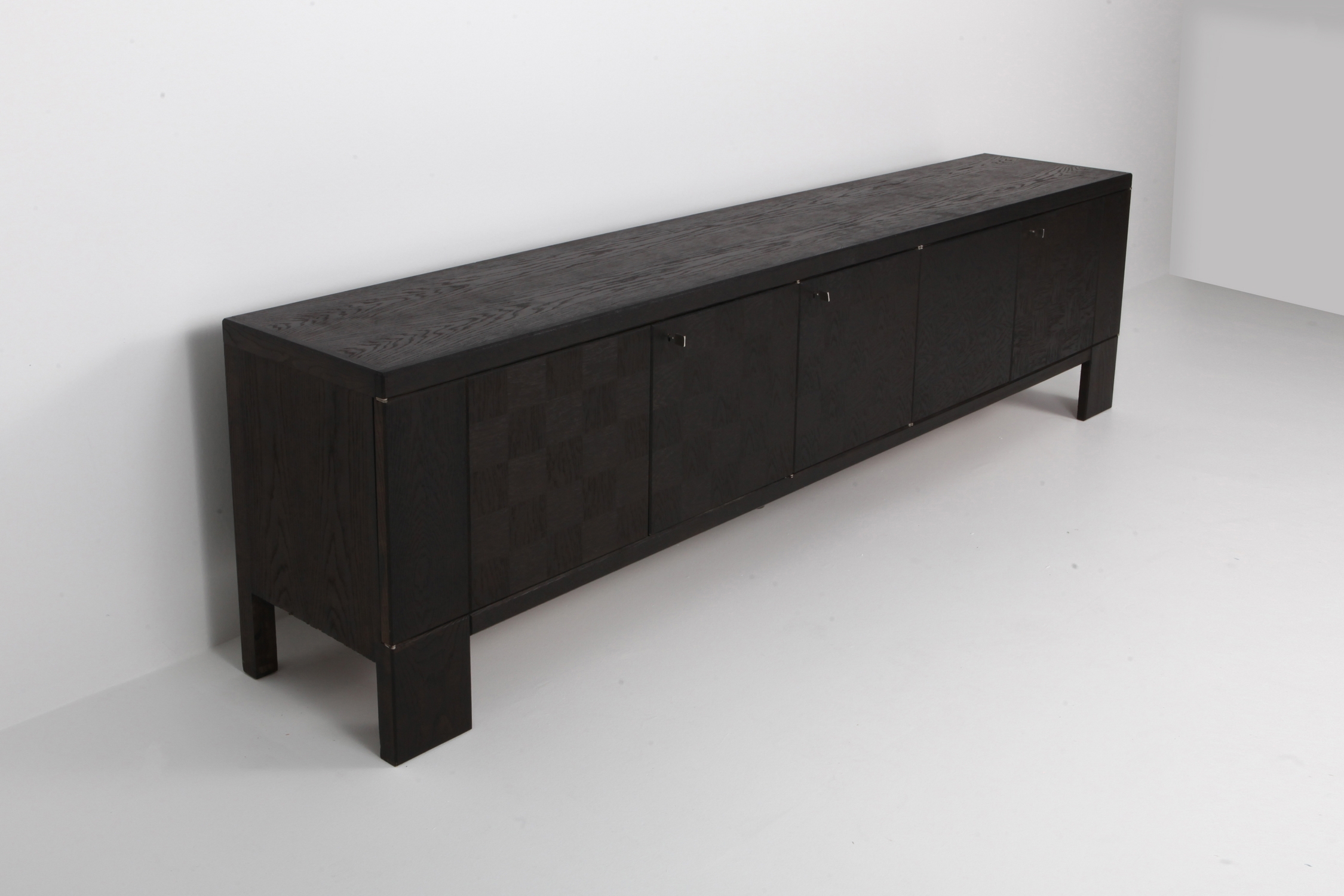Brutalist Floating Credenza in Stained Oak with Geometric Doors by De Coene - 1970s